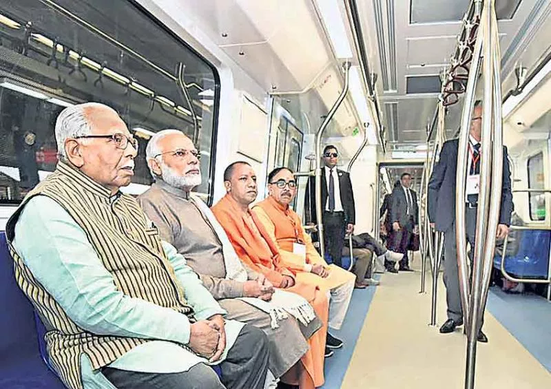 PM Modi throws open Delhi Metro's Magenta Line; boards 'driverless' train at Noida's Botanical Garden - Sakshi