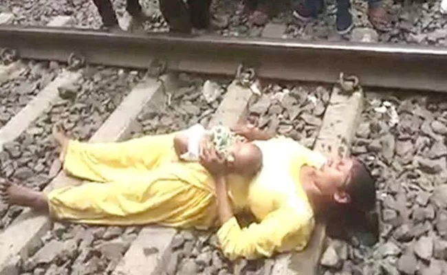 Mother Infant Escapes Railway Accident in MP - Sakshi
