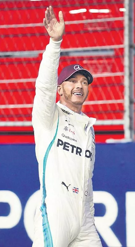 Lewis Hamilton takes surprise pole for Singapore Grand Prix - Sakshi