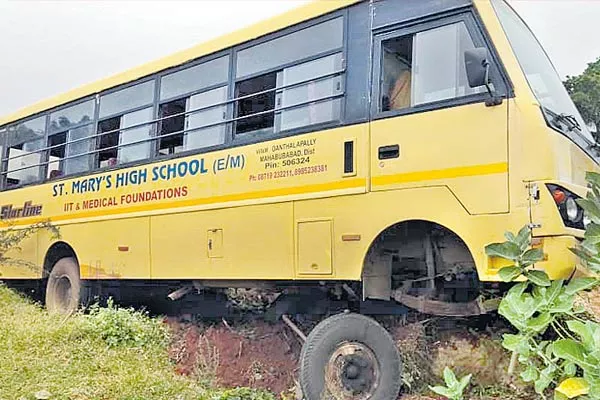 Private school bus collided with a rock - Sakshi