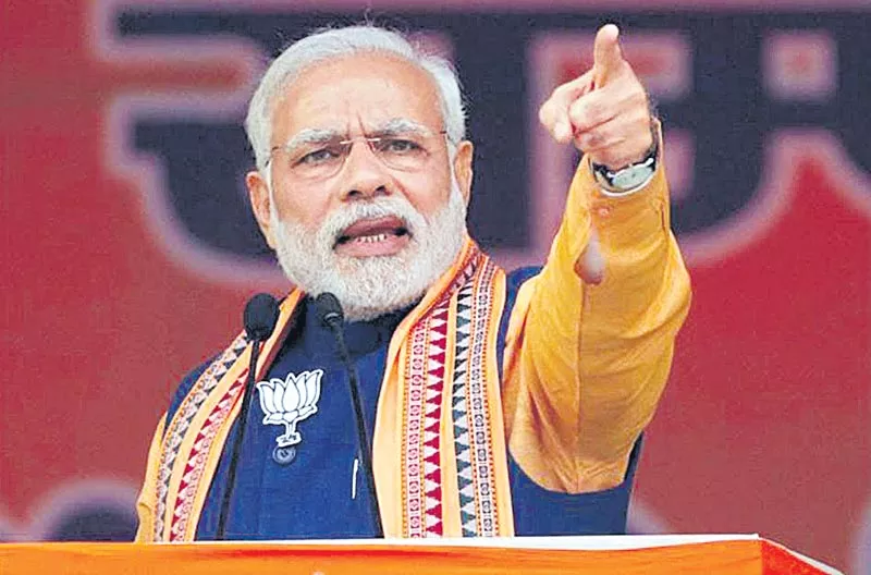 PM Modi slams Congress while addressing BJP workers - Sakshi