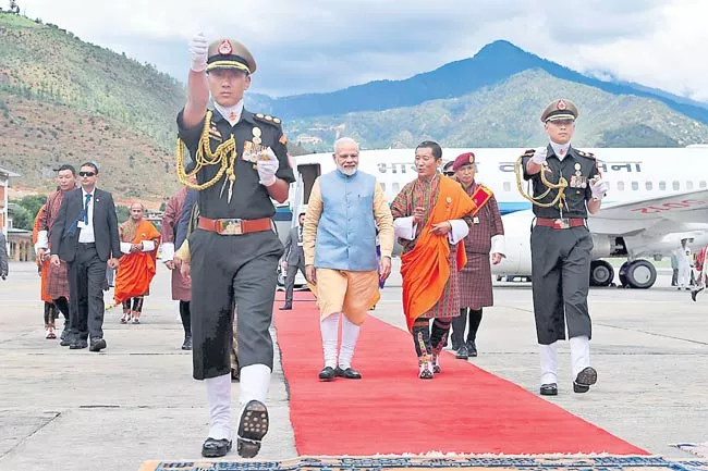 Narendra Modi cements Bhutan ties with RuPay launch - Sakshi