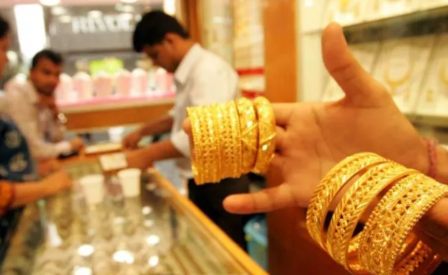 Gold drops Rs 128, silver prices plunge Rs 700      - Sakshi