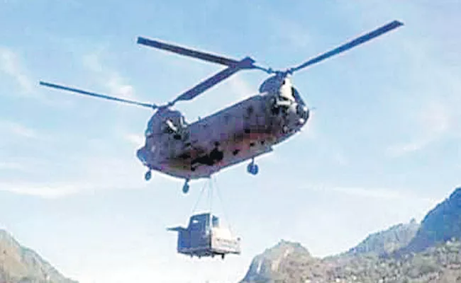 Helicopters land heavy equipment to expedite work of strategic road - Sakshi