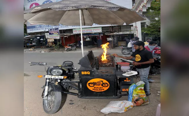 Man Making Recipies On Bullet Bike In Nizamabad - Sakshi