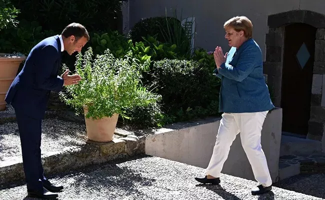 Macron and Merkel Switch To Namaste In The Time Of Covid - Sakshi