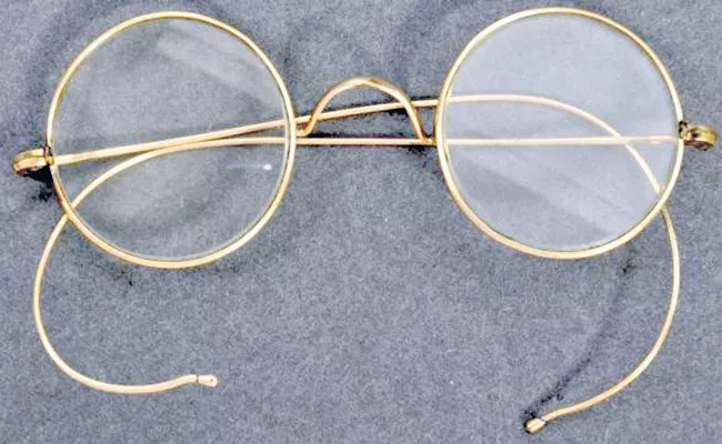Mahatma Gandhi gold-plated spectacles sell for a record price - Sakshi