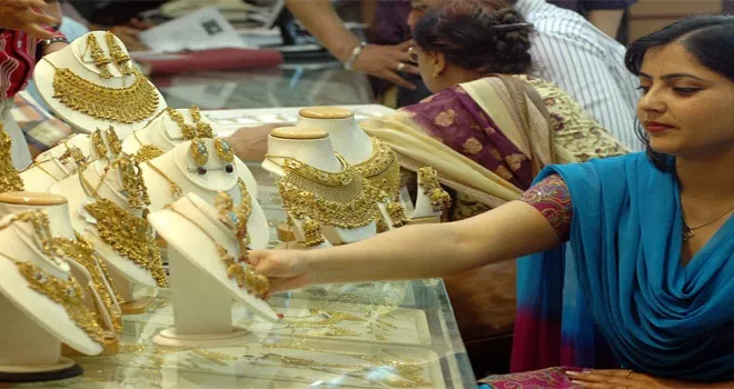 Gold, Silver prices jumps in MCX, New York Comex - Sakshi