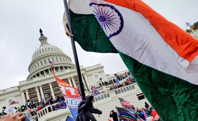 Indian Flag At Capitol Bhavan Protest Against Trump - Sakshi