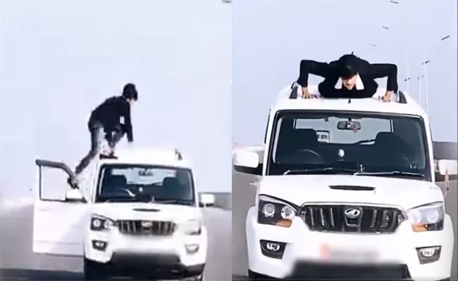 Viral Video: Man Does Push Ups On Rof Of Moving Car, What next - Sakshi