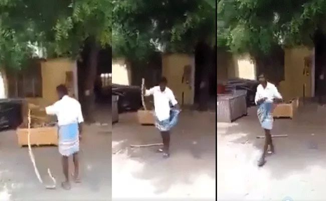 Shocking Video: Brave Man Catches Snake, Puts It In His Lungi - Sakshi