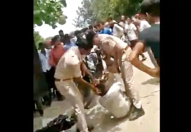 2 Cops Thrash Disabled Man In Full Public View In Rajasthan - Sakshi
