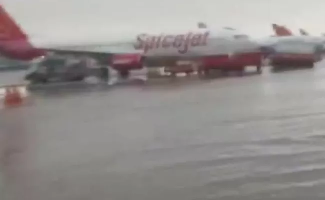 Indira Gandhi Delhi Airport Waterlogged: Flights Diverted - Sakshi