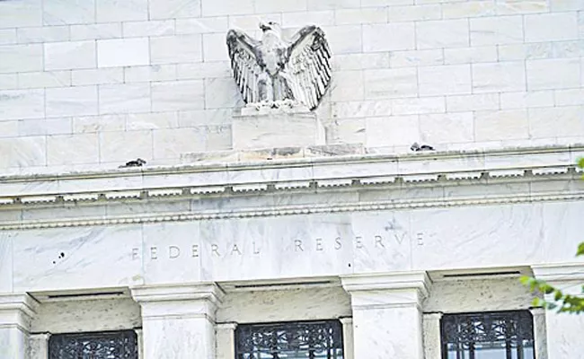 Fed hikes its benchmark interest rate by 0. 75 percentage - Sakshi