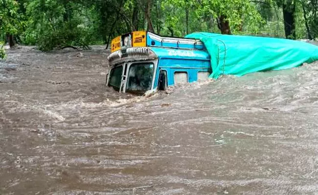 PDS Rice Carrying Truck Swept Away In Flood Water At Bijapur - Sakshi