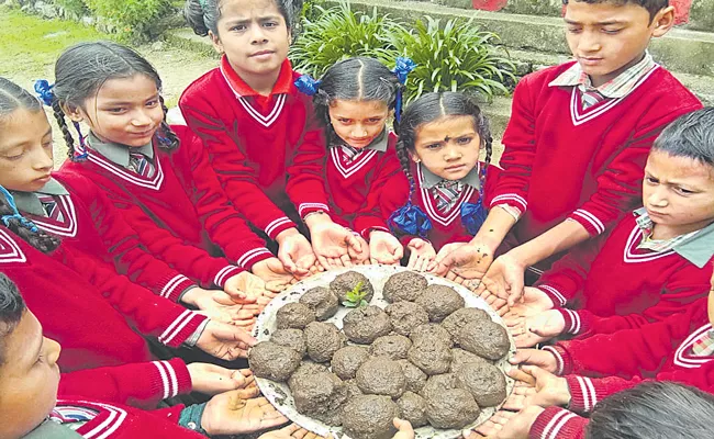 Uttarakhand CM Kicks Off Seed Bomb Spreading Campaign - Sakshi