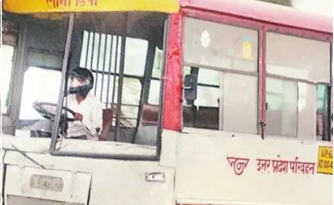 Utter Pradesh Man Driving Bus Wearing Helmet Video Viral - Sakshi