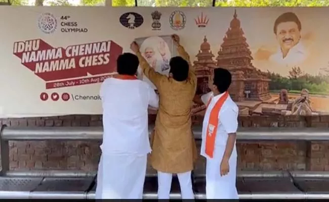 Viral Video: BJP Man Sticks PMs Photo On Billboards Of Tamil Nadu  - Sakshi