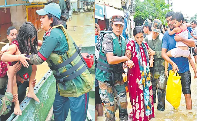 Assam Rifles conducts rescue operations in Assam Floods - Sakshi