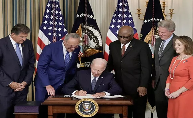 US President Biden signs major climate change and health care - Sakshi