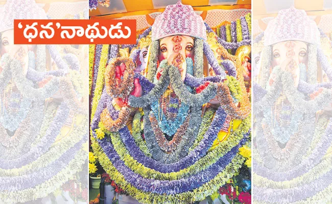 Ganesh Chaturthi 2022: Ganesh Idol Decorated With Currency Notes in Guntur - Sakshi