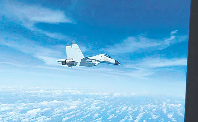 Chinese navy jet flies of US air force plane over South China Sea - Sakshi