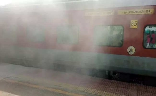 Smoke Coming From Rajdhani Express Train At Kavali - Sakshi
