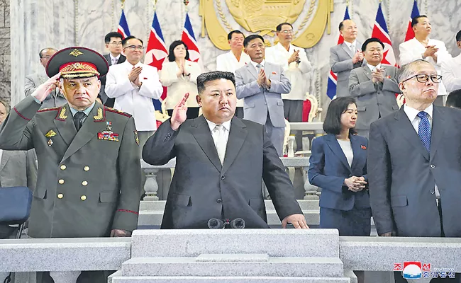 North Korea Kim Jong Un displays nuclear-capable missiles, drones at parade - Sakshi