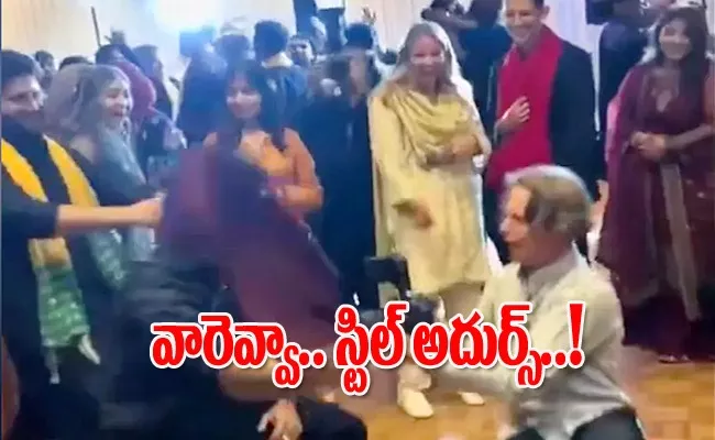 Wedding Photographer Matches Dance Steps With Guests - Sakshi