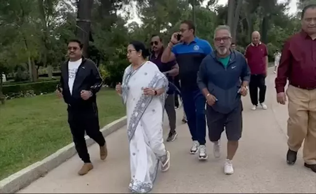Video: Jogging In Saree Slippers Mamata Banerjee Insta Post From Spain - Sakshi