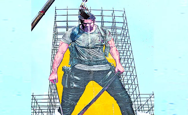 Fan make the biggest ever cutout of Prabhas poster on his birthday for his upcoming film Salaar - Sakshi