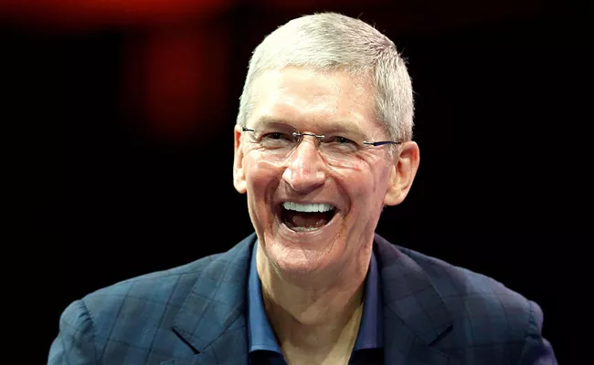Tim Cook Earned By Selling Apple Share - Sakshi