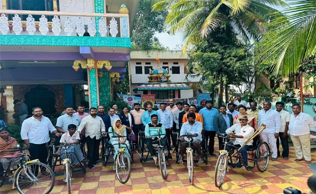 TTA Seva Days Distribution Of Tricycles In Gajwel - Sakshi