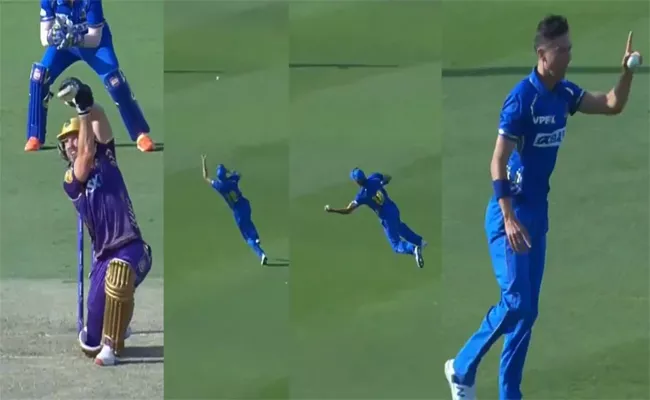 Trent Boult takes a one-handed stunner to dismiss Laurie Evans  - Sakshi
